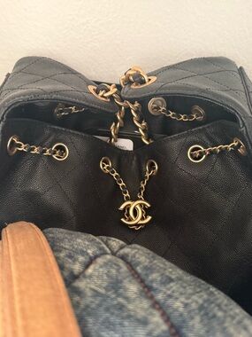CHANEL Black Quilted Leather Drawstring Backpack with Gold CC Charm